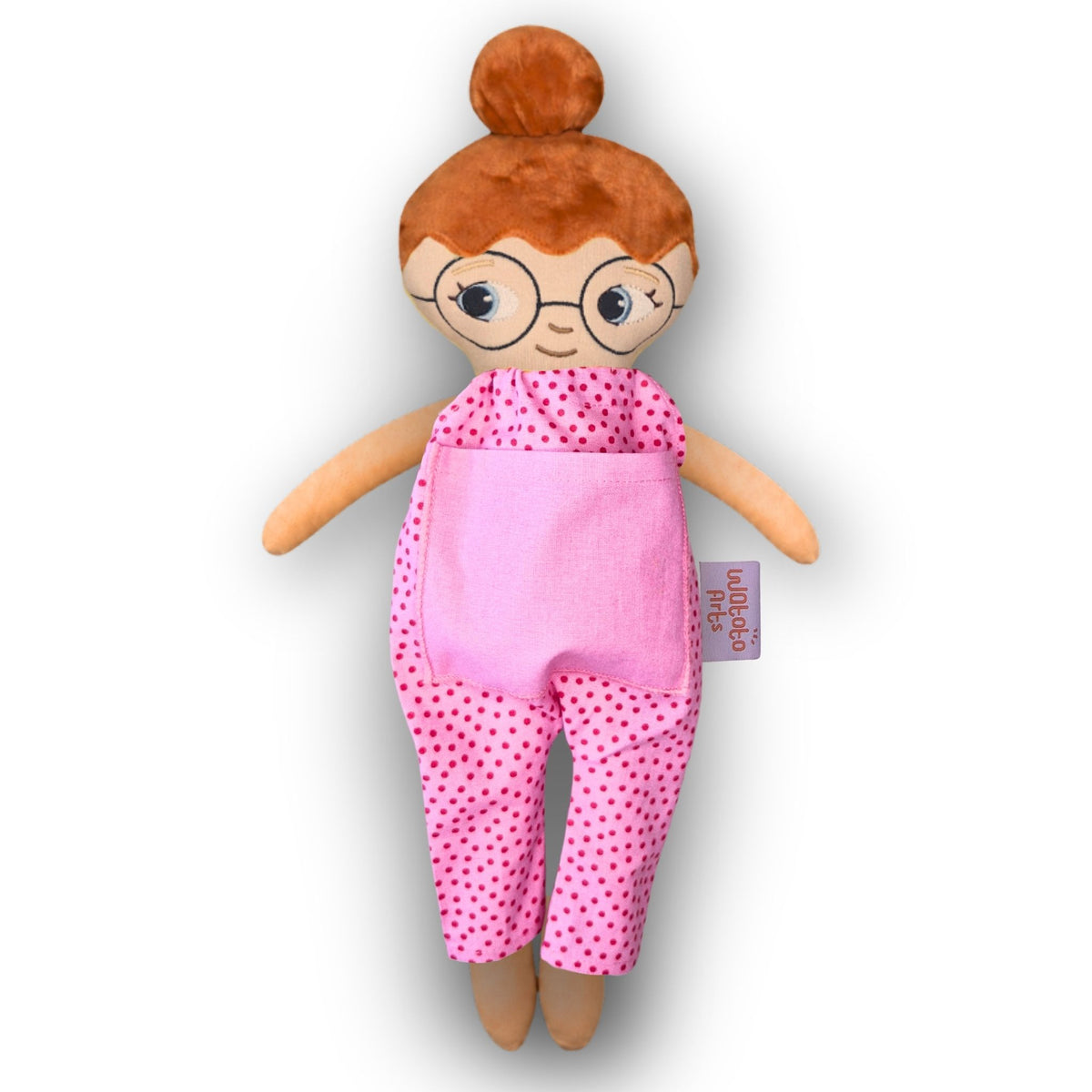 Dockan Mia med glasögon, rött hår i en hårknut och rosa jumpsuit.