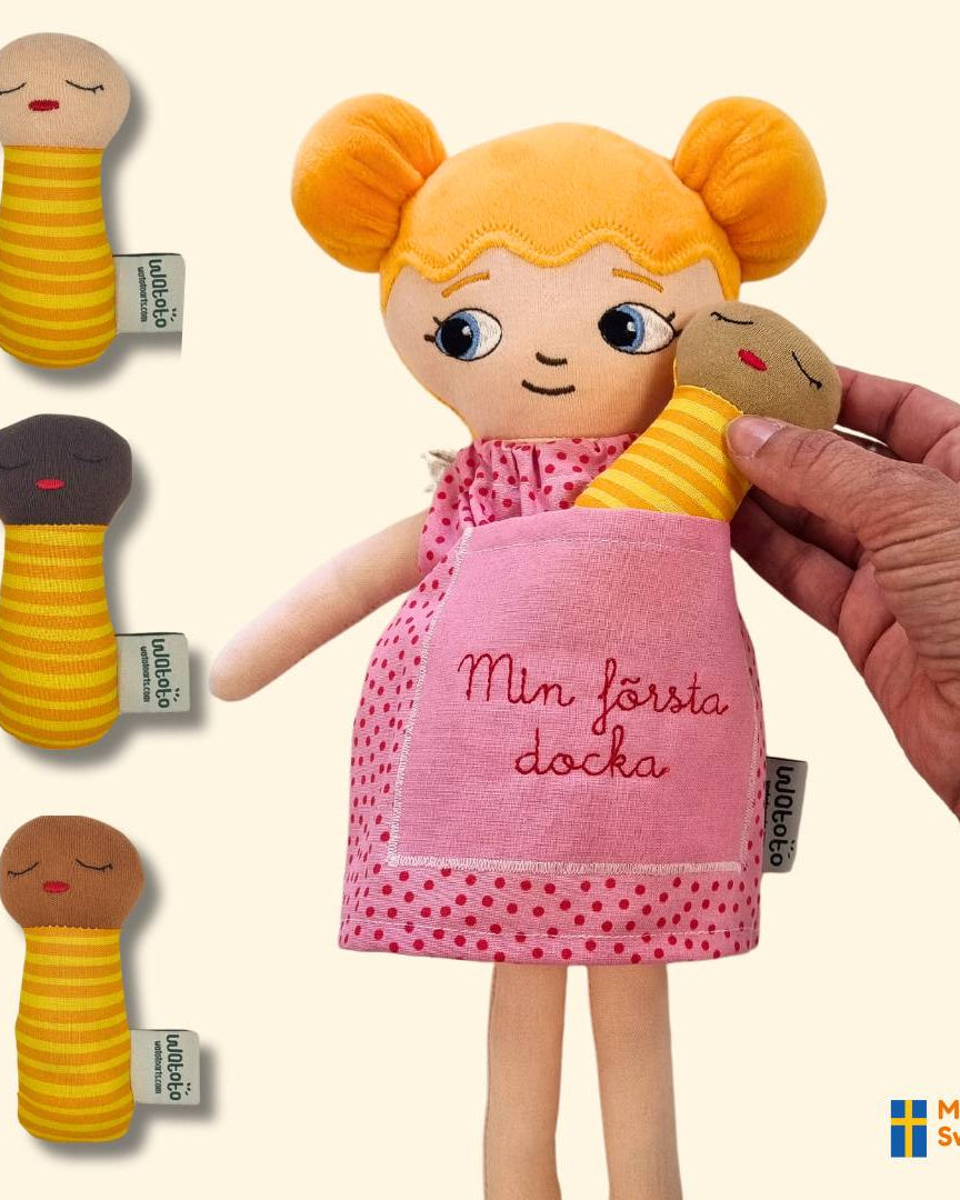 Watoto arts dockor kan kombineras med bebisdockor och med personlig brodyr.