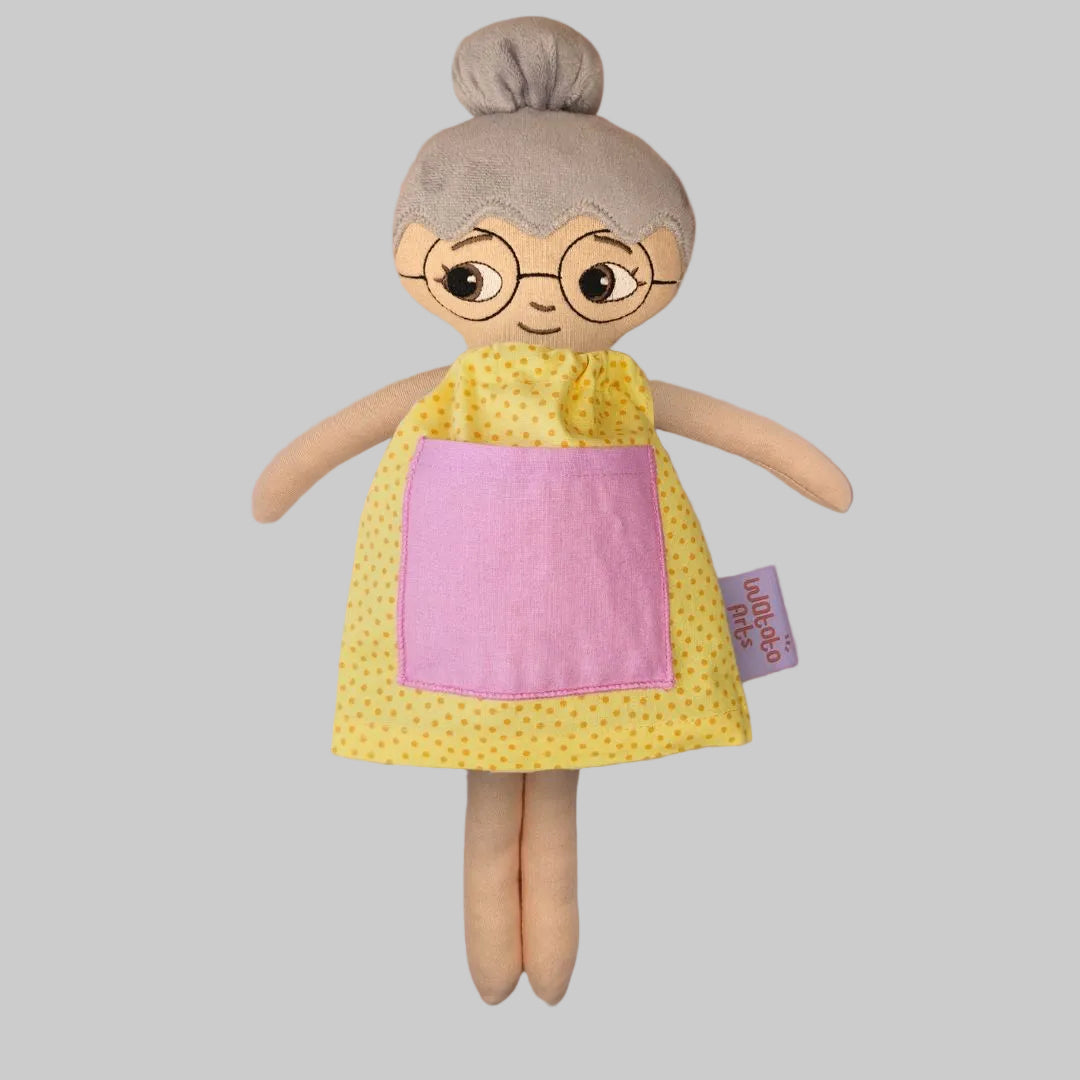 Docka Greta med hårknut och glasögon