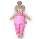 Docka mormor/farmor med grått hår, vit hud och blå ögon – rosa jumpsuit