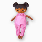 mjuk docka Fatima i rosa jumpsuit på vit bakgrund